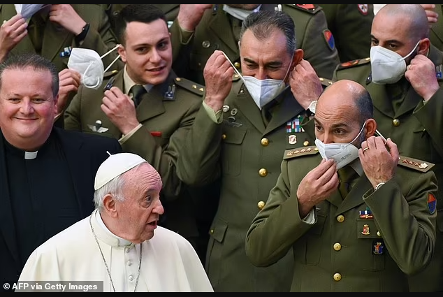 Pope Francis tells Italian Army officers to remove their Covid masks as they pose for a photo at the Vatican (photos)