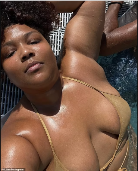 Singer, Lizzo showcases her curves in a shimmering gold string bikini 